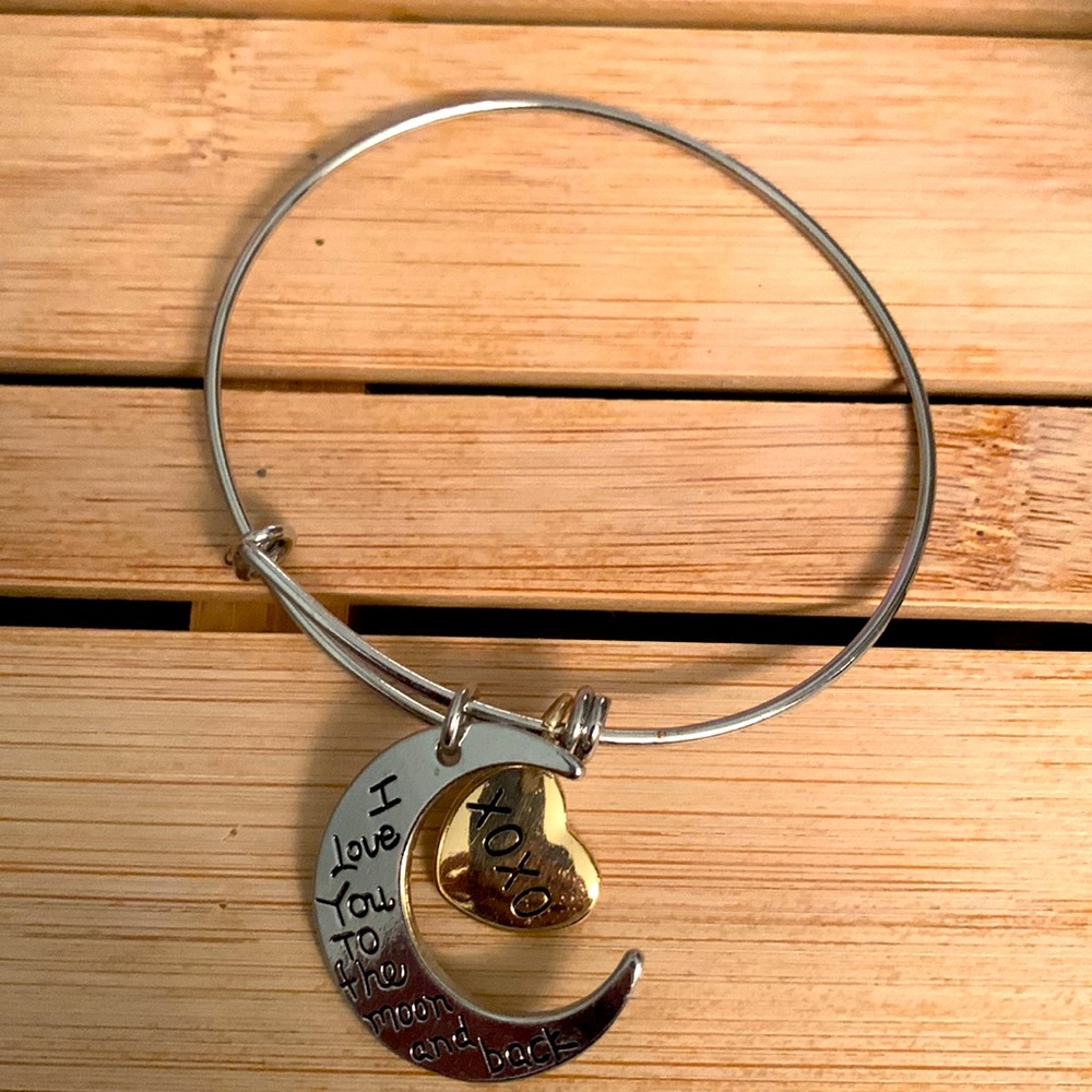 Dangle bracelet with moon and heart.